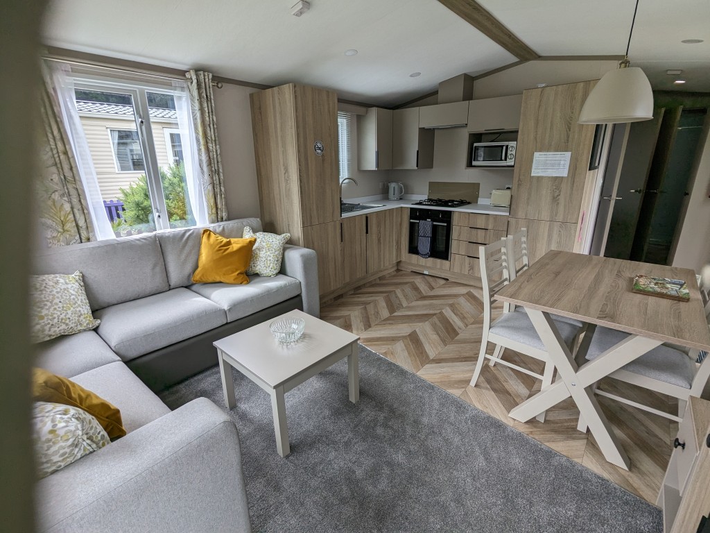 Lounge, dining area in a static caravan holiday rental Newquay Cornwall
